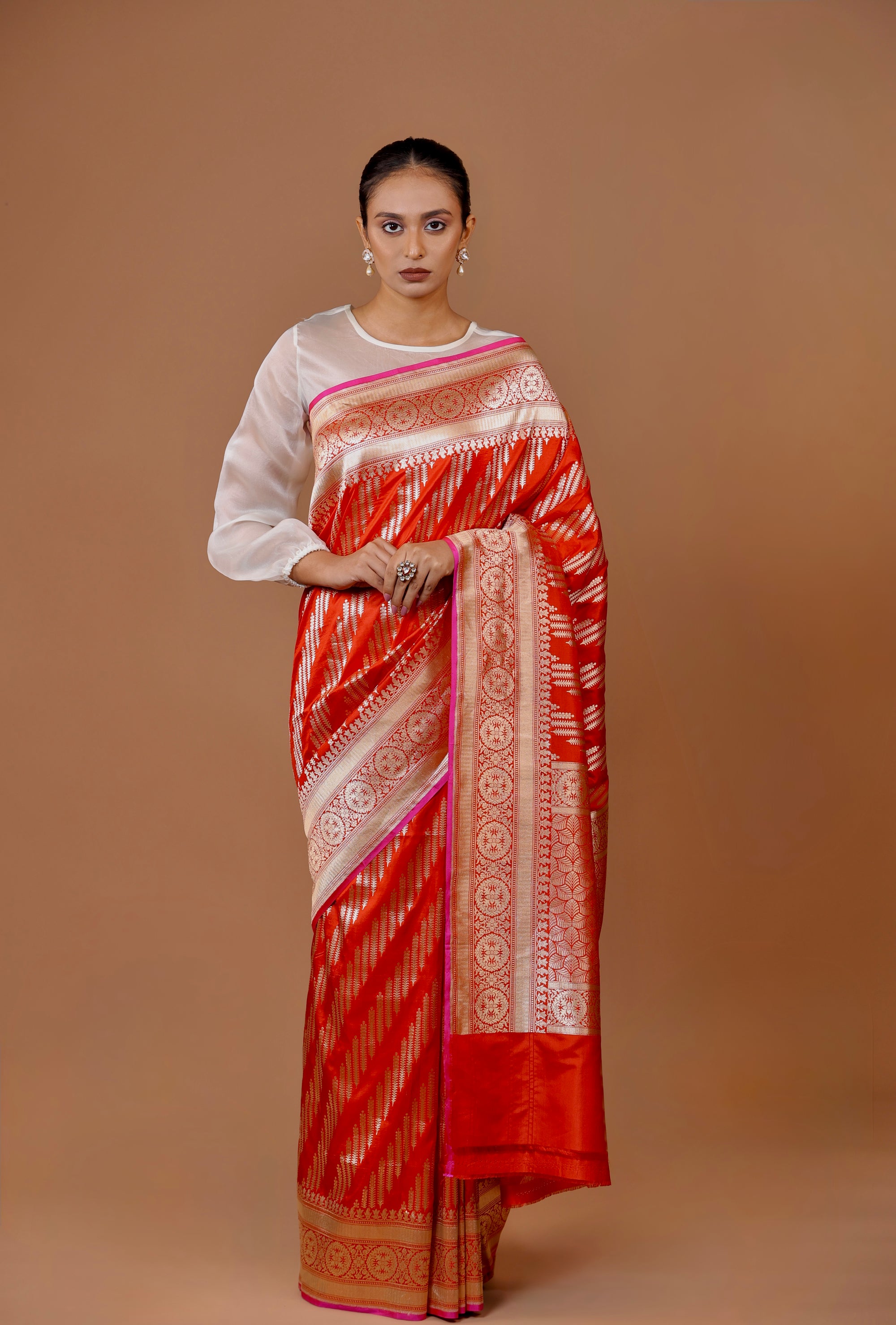 Banarasi handwoven Red silk sari in rich hues with intricate weaving.