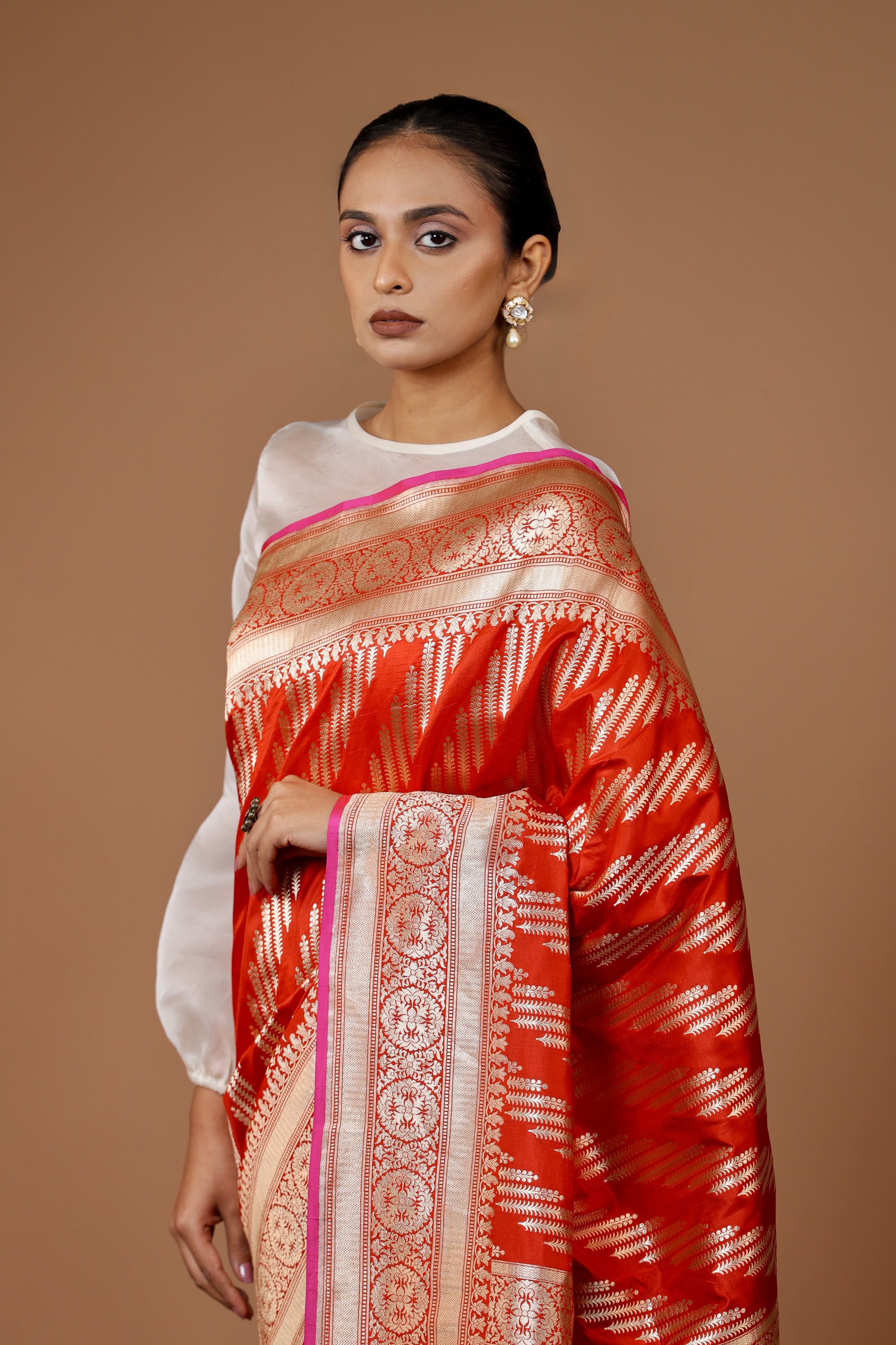 Banarasi handwoven Red silk sari in rich hues with intricate weaving.