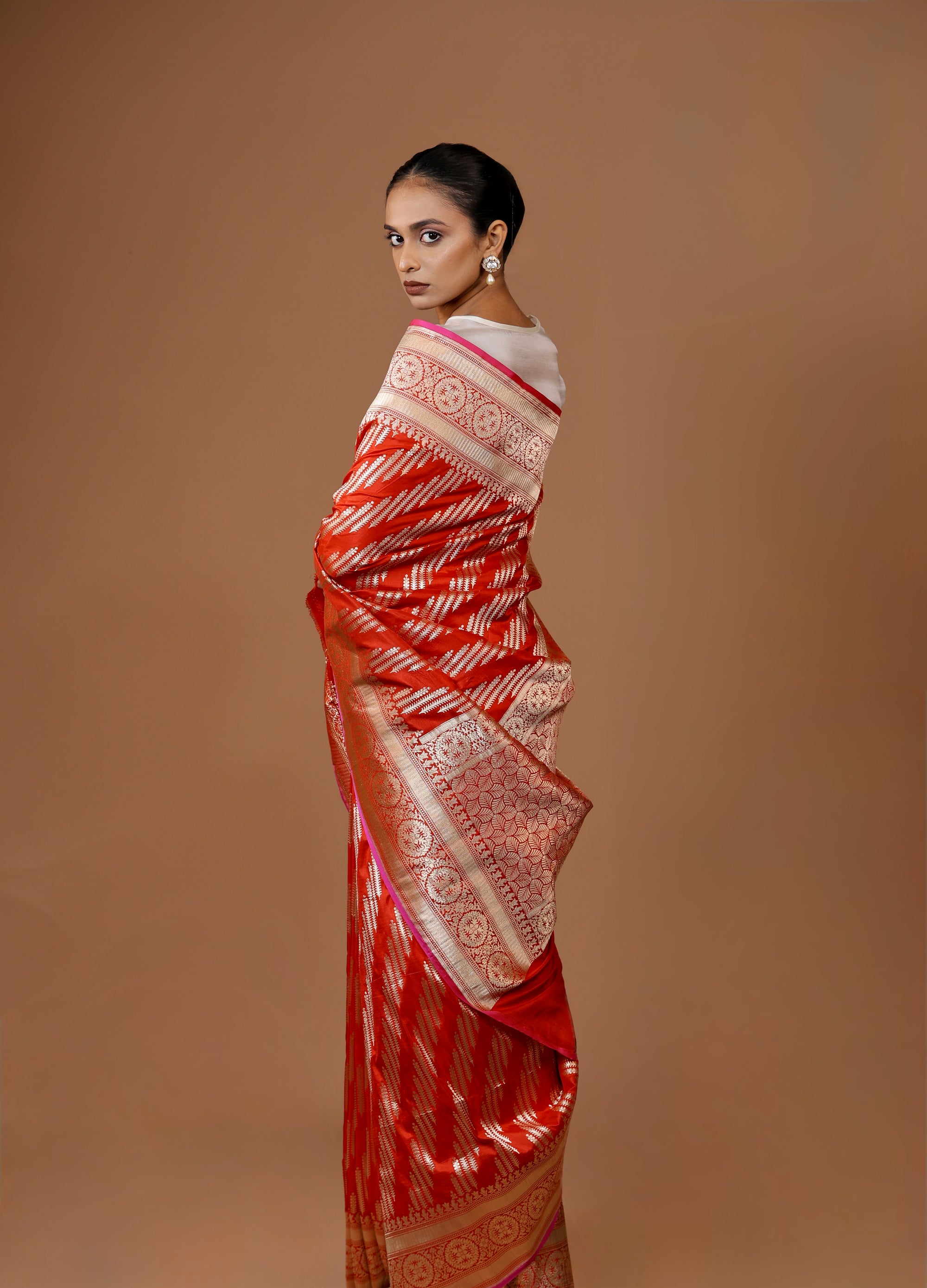 Banarasi handwoven Red silk sari in rich hues with intricate weaving.