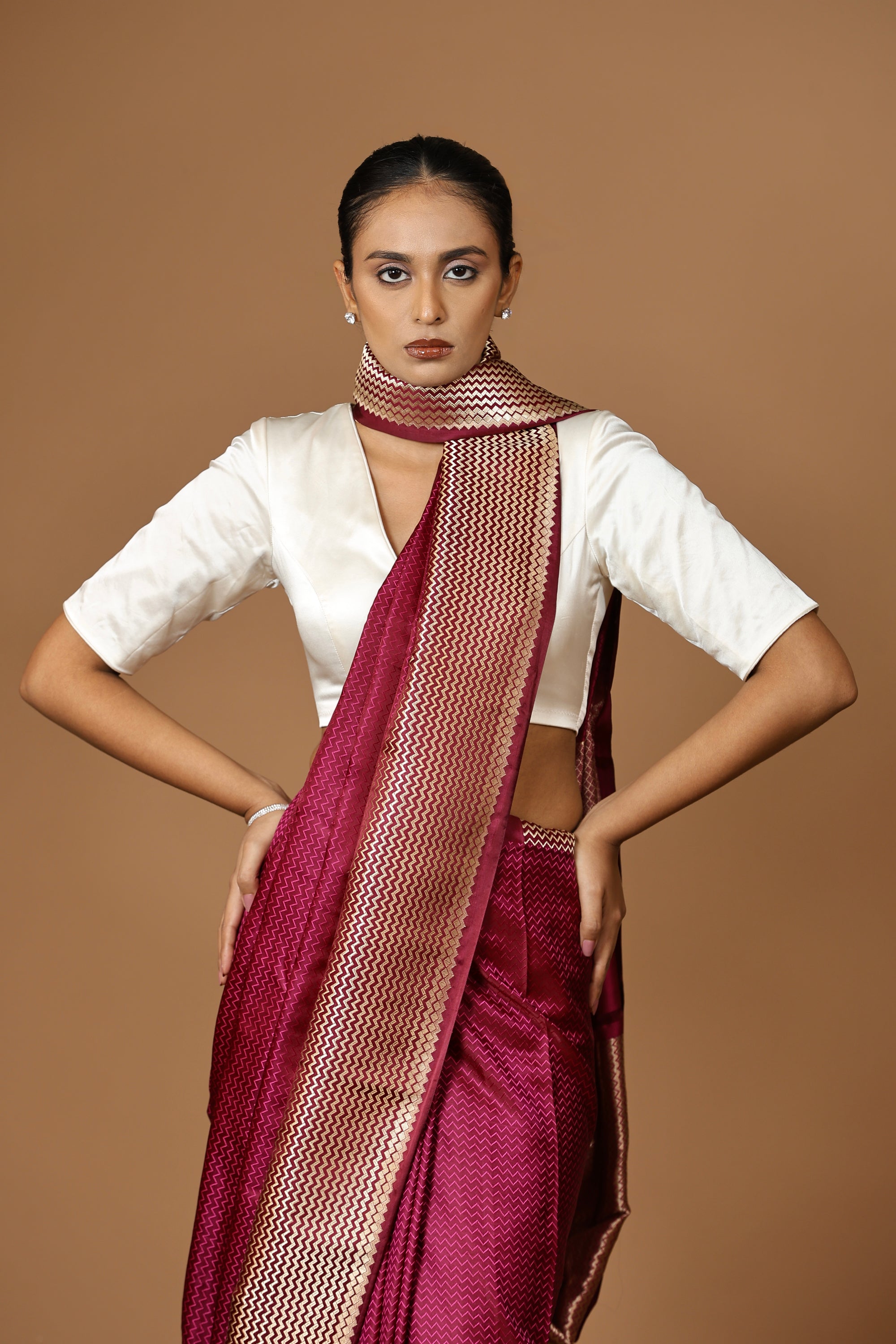 Exquisite Banarasi Tanchoi silk sari in deep Bordeaux, highlighted with a striking contrast border.