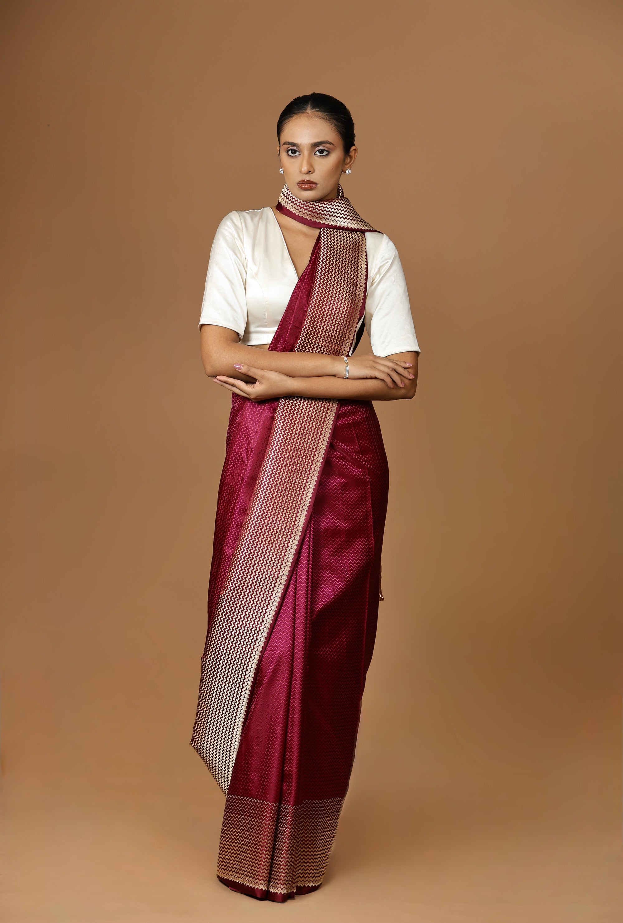 Exquisite Banarasi Tanchoi silk sari in deep Bordeaux, highlighted with a striking contrast border.