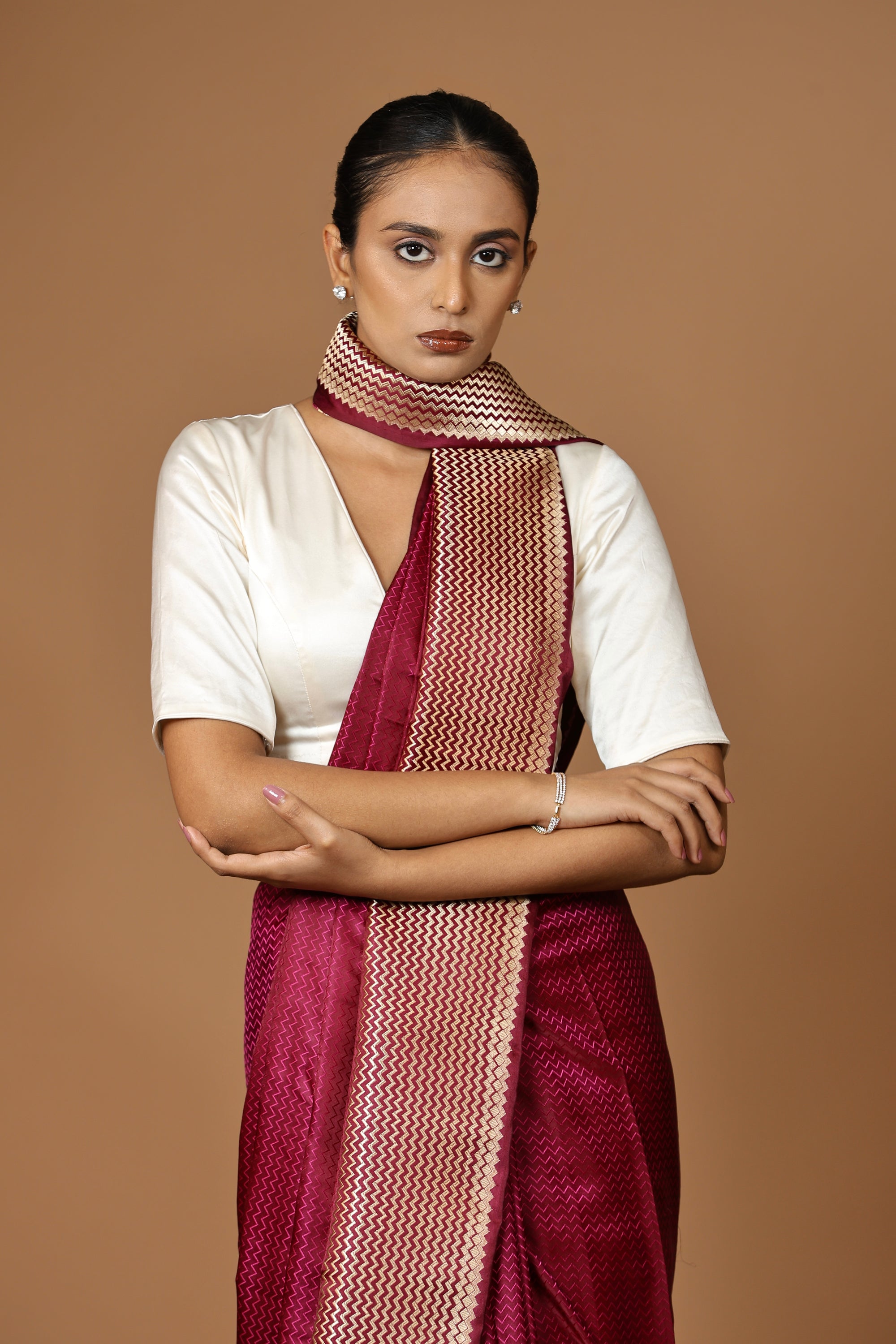 Exquisite Banarasi Tanchoi silk sari in deep Bordeaux, highlighted with a striking contrast border.