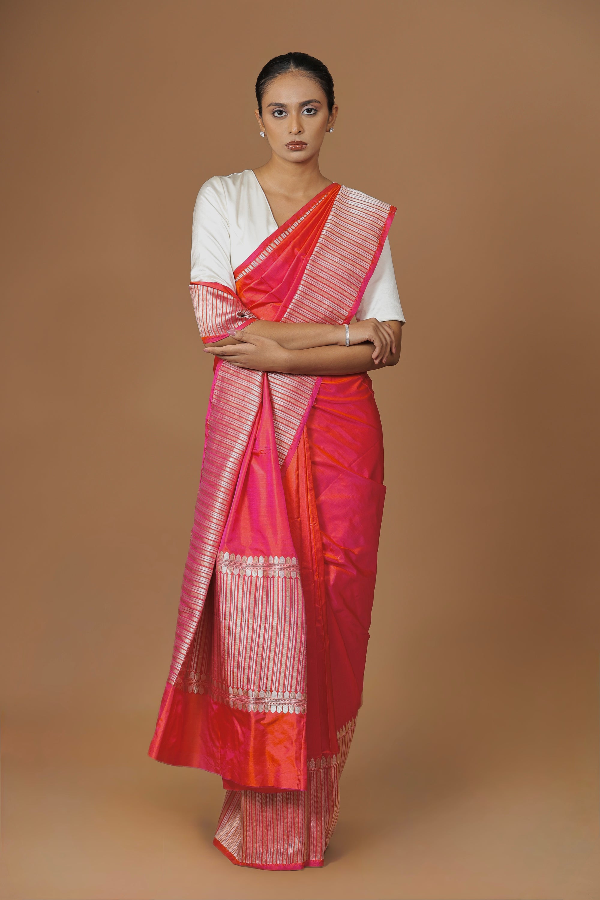 Radiant Banarasi handwoven fuchsia silk sari, highlighted with an intricately woven border.