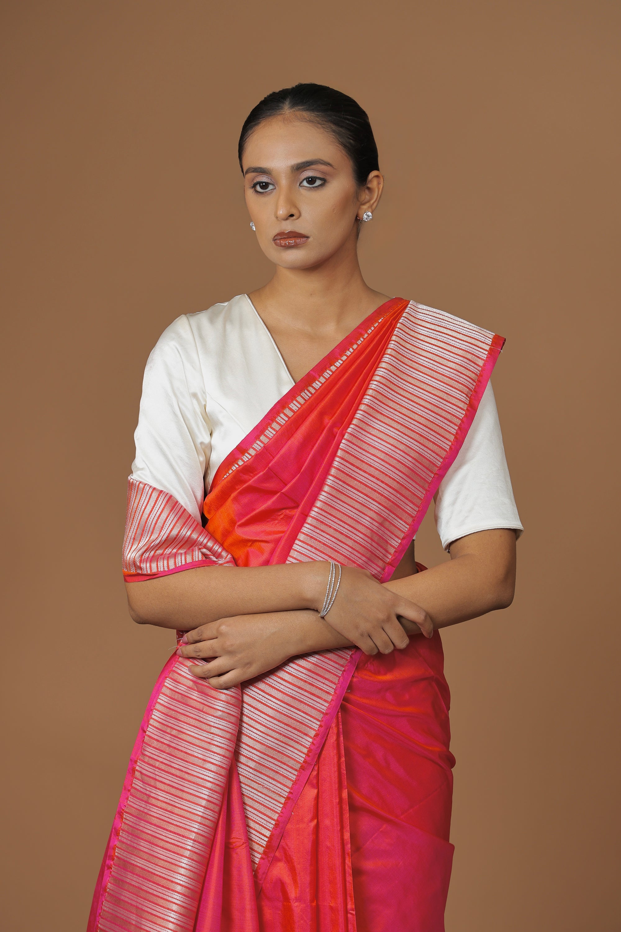 Radiant Banarasi handwoven fuchsia silk sari, highlighted with an intricately woven border.