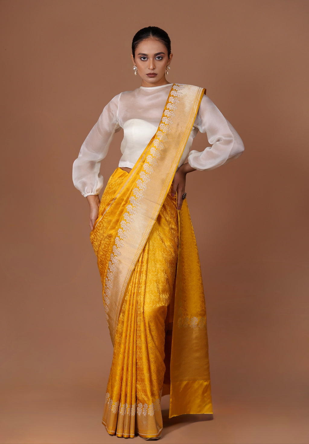 Radiant Banarasi handwoven Yellow silk Tanchoi sari with delicate woven patterns and refined elegance.