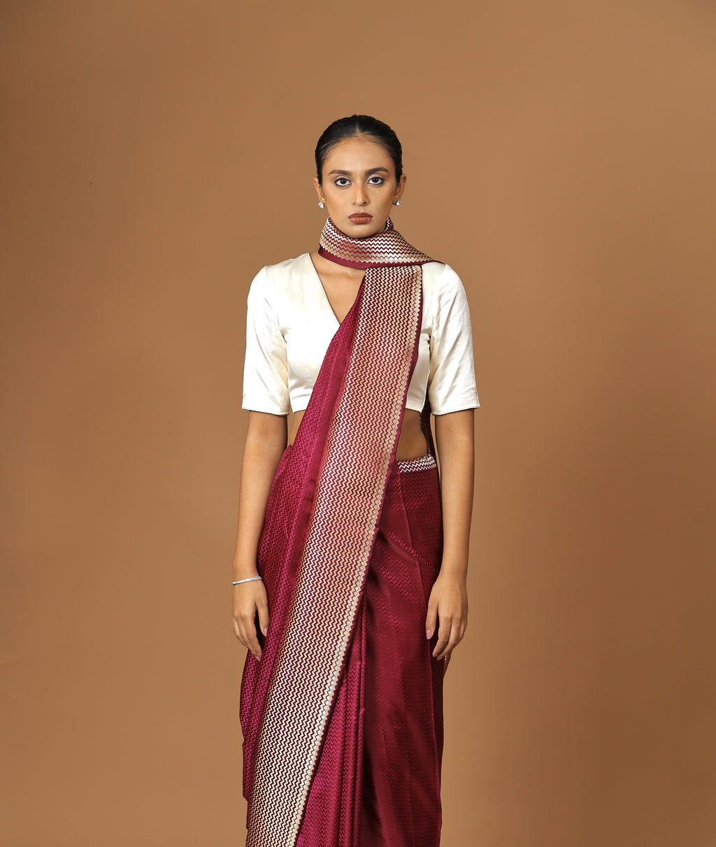 Exquisite Banarasi Tanchoi silk sari in deep Bordeaux, highlighted with a striking contrast border.