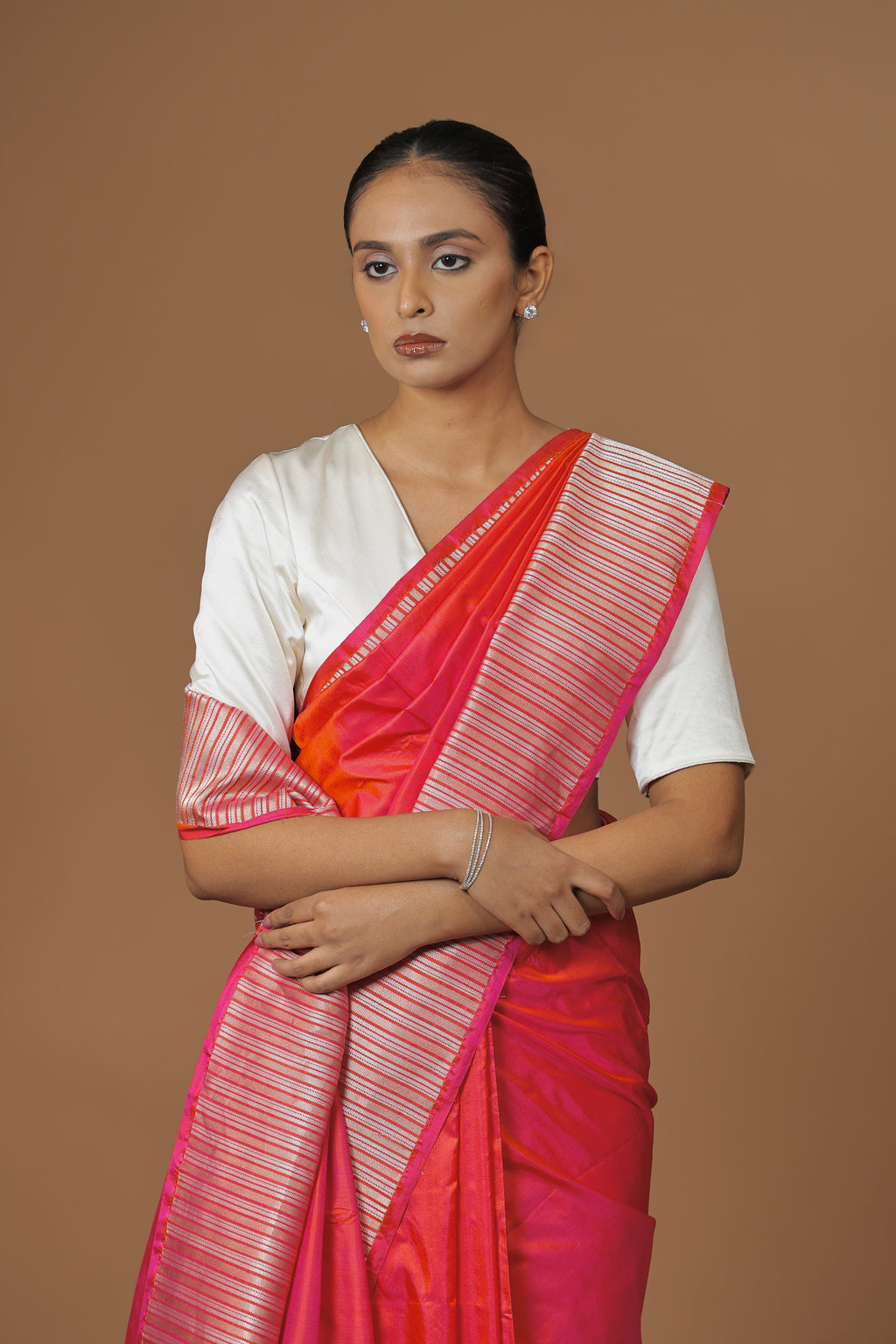 Radiant Banarasi handwoven fuchsia silk sari, highlighted with an intricately woven border.