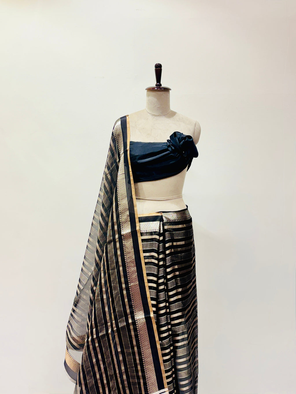 Black soft organza saree with zari stripes detail
