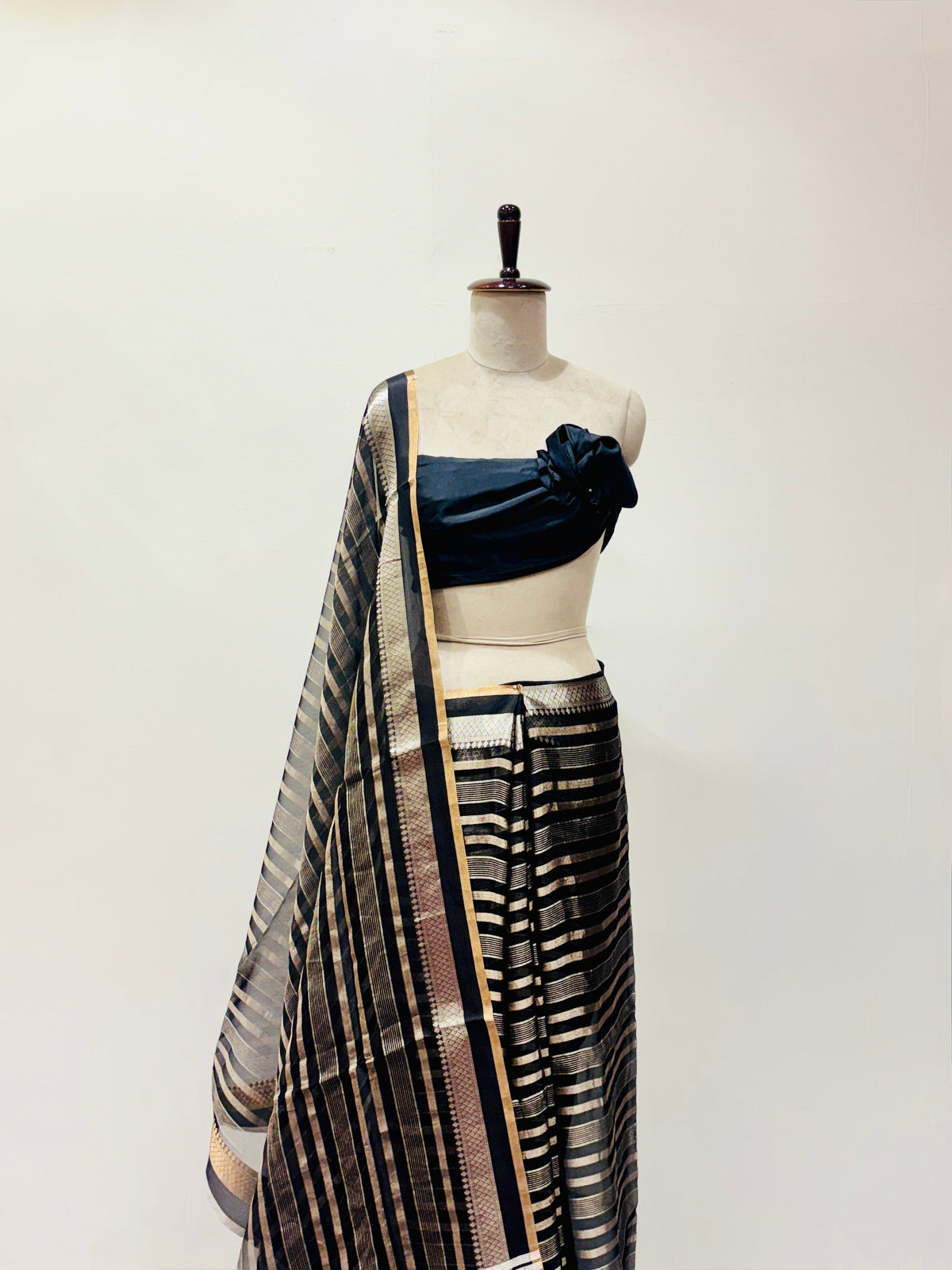 Black soft organza saree with zari stripes detail