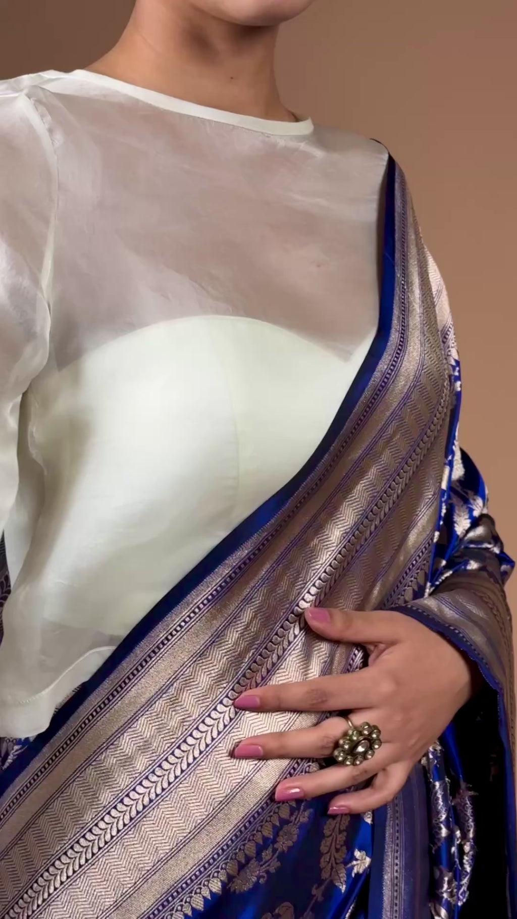 Banarasi handwoven Blue silk Shikargah sari adorned with intricate motifs and exquisite detailing.